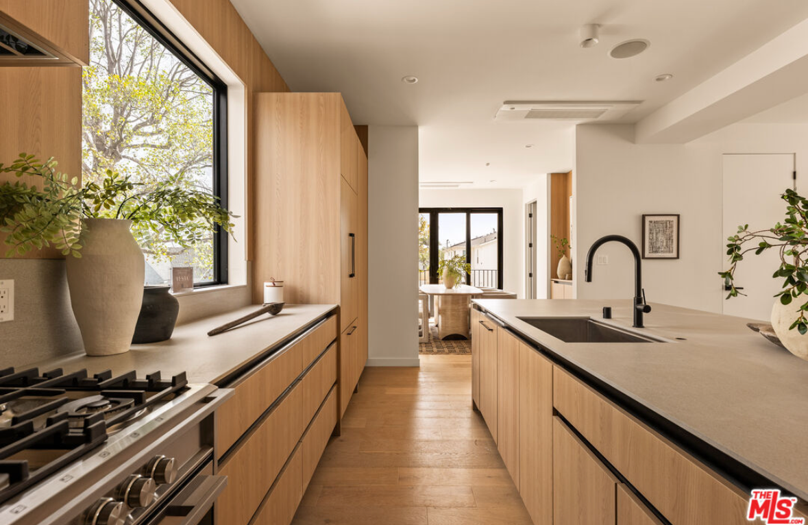 Modern kitchen island with sink and gas range installation